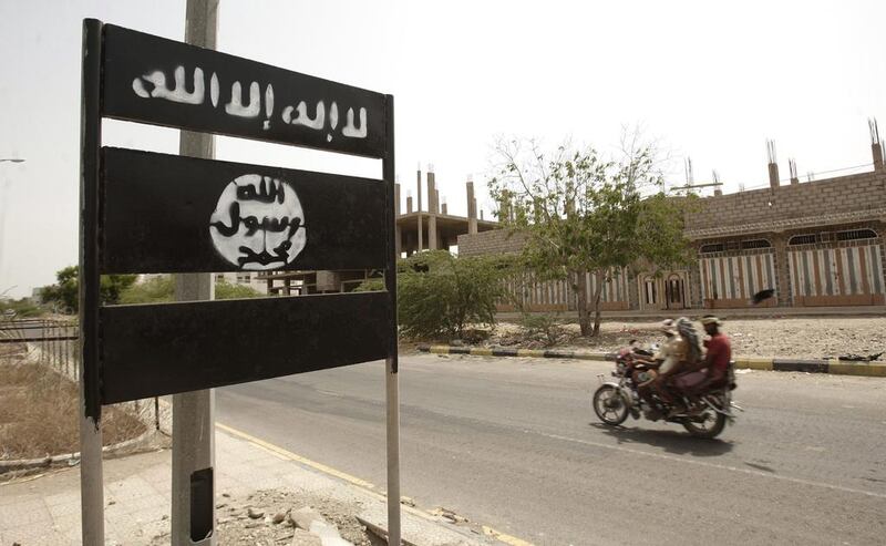 An Al Qaeda logo on a street sign is seen here in the town of Jaar in Yemen’s southern Abyan province in 2012. Hani Mohammed / AP Photo