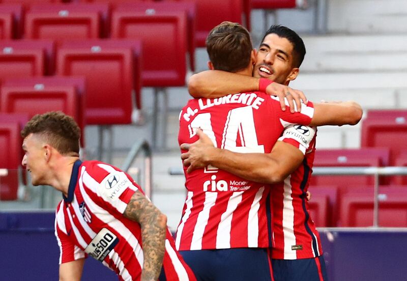 Luis Suarez celebrates scoring Atletico's fifth goal. Reuters