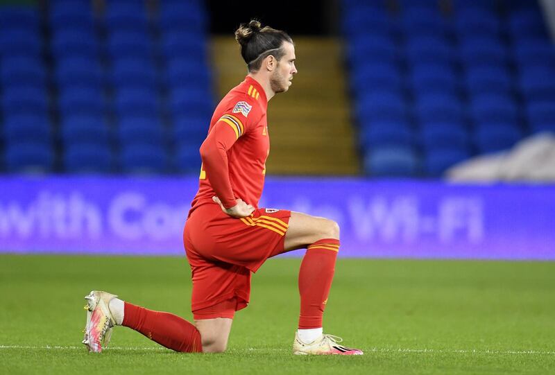 Gareth Bale of Wales takes a knee before match. EPA