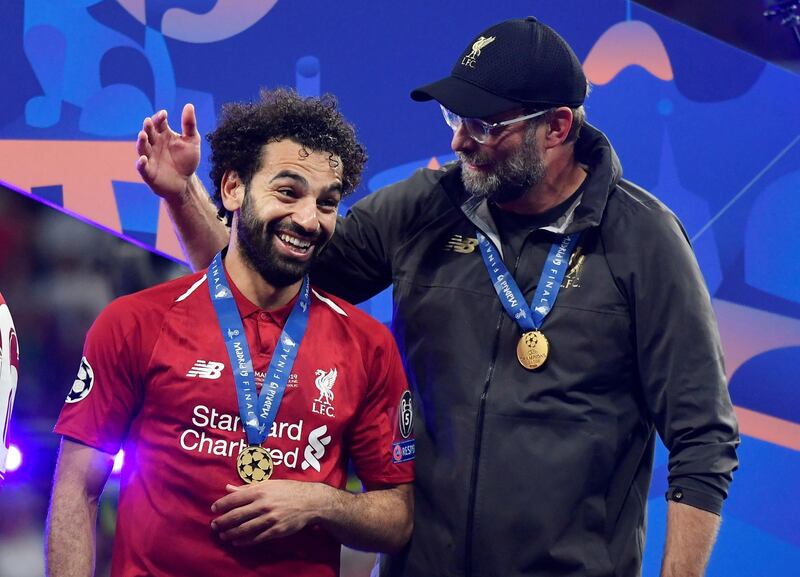 Klopp celebrates with Mohamed Salah at the final whistle. Reuters