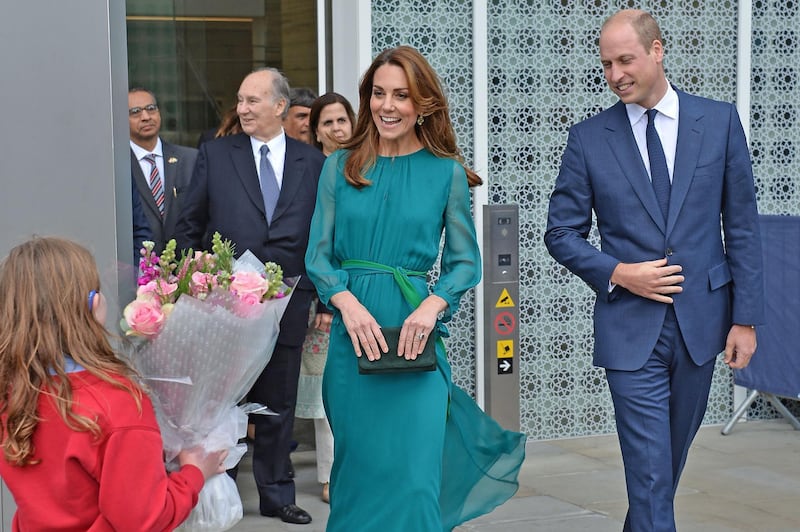 The children presented the Duchess of Cambridge with a bunch of flowers. AFP