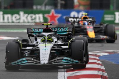 Mercedes' British driver Lewis Hamilton races ahead of Red Bull Racing's Mexican driver Sergio Perez at Mexico City on Sunday. AFP