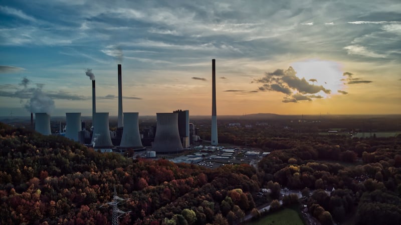 The sun sets behind a coal-fired power plant in Gelsenkirchen, Germany. AP