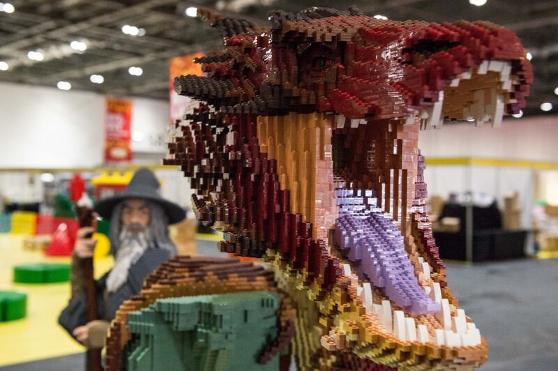 A Lord of the Rings display includes Smaug the dragon, made from 83,433 bricks that took 625 hours to build, with Bilbo Baggins and Gandalf at ExCel. Getty Images