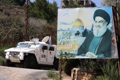 An armoured vehicle of the UN Interim Force in Lebanon patrols near a billboard with a portrait of Hezbollah secretary general Hassan Nasrallah in the southern town of Houla last August. AFP