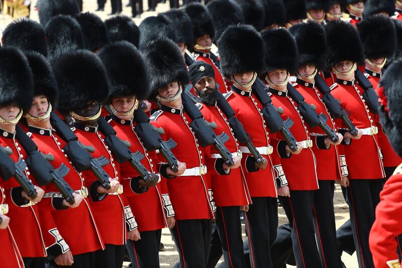 Coldstream Guards, including Guardsman Charanpreet Singh Lall, aged 22, a Sikh from Leicester who is the first soldier to wear a turban during the Trooping the Colour parade, march down The Mall as part of Trooping the Colour in central London, Britain. REUTERS / Simon Dawson