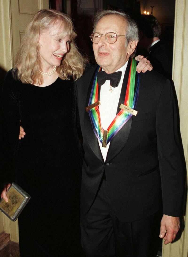 FILE PHOTO: Kennedy Center honoree Andre Previn is greeted by actress and former wife Mia Farrow following the presentation ceremony of the Kennedy Center Honors held at the State Department in Washington December 5, 1998. REUTERS/Larry Downing/File Photo