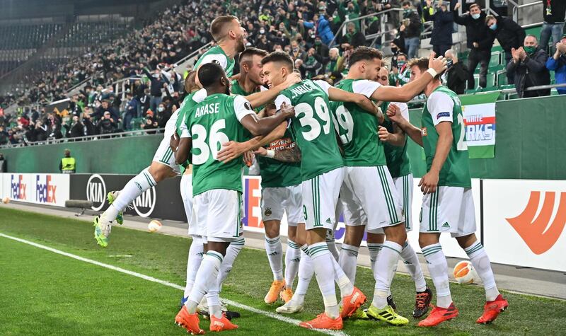 Rapid Vienna's player celebrate Taxiarchis Fountas' goal. AFP