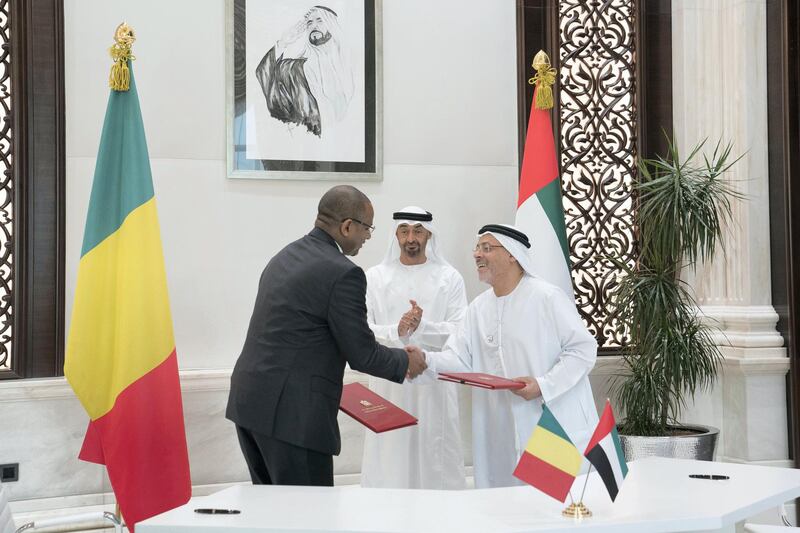 ABU DHABI, UNITED ARAB EMIRATES - May 20, 2019: HH Sheikh Mohamed bin Zayed Al Nahyan, Crown Prince of Abu Dhabi and Deputy Supreme Commander of the UAE Armed Forces (back), witnesses an MOU signing ceremony between HE Boubou Cisse, Prime Minister of Mali (L) and HE Hussain Al Nowais, Chairman of the Khalifa Fund to Support and Develop Small & Medium Enterprises (R), at Al Bateen Palace.

( Eissa Al Hammadi for the Ministry of Presidential Affairs )
---