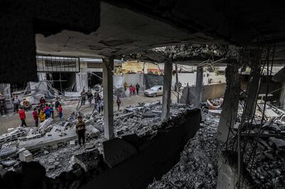 People inspect damage to their homes caused by Israeli air strikes on January 3, in Rafah, Gaza. Getty Images
