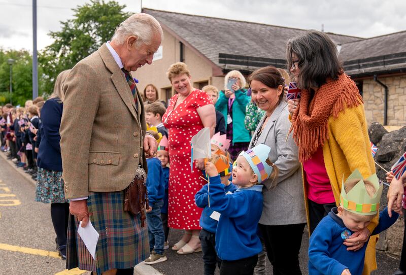 King Charles with children and parents in the Scottish town. Getty Images