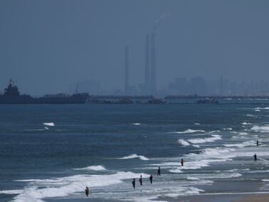 A ship is seen off the coast of Gaza near a U. S. -built floating pier that will be used to facilitate aid deliveries, as seen from the central Gaza Strip, Thursday, May 16, 2024.  (AP Photo / Abdel Kareem Hana)