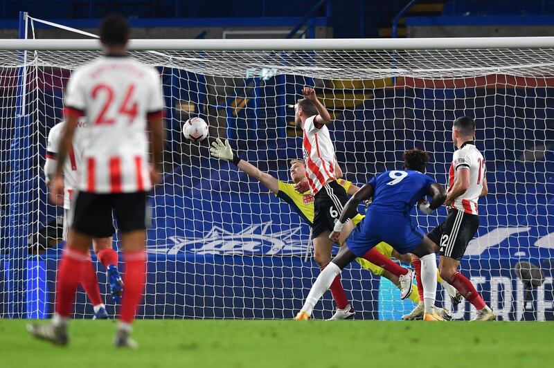 LONDON, ENGLAND - NOVEMBER 07: Tammy Abraham of Chelsea scores his team's first goal during the Premier League match between Chelsea and Sheffield United at Stamford Bridge on November 07, 2020 in London, England. Sporting stadiums around the UK remain under strict restrictions due to the Coronavirus Pandemic as Government social distancing laws prohibit fans inside venues resulting in games being played behind closed doors. (Photo by Ben Stansall - Pool/Getty Images)