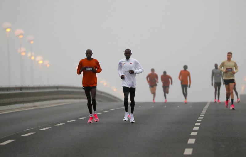 Kenya's Eliud Kipchoge, the marathon world record holder, warms up before the start of his attempt to run a marathon in under two hours in Vienna, Austria. REUTERS