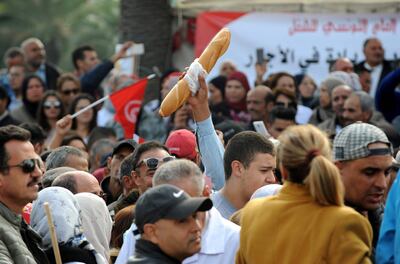 epa07183168 People protest during a general strike in Tunis, Tunisia, 22 November 2018. Some 670 thousand civil servants went on strike on 22 November 2018 after the Tunisian General Labor Union (UGTT) and the Tunisia government failed to reach an agreement to increase the salaries by the government. Protesters said that the loan by the International Monetary Fund (IMF) to Tunisia was one of the main factors of the government refusal. Tunisia agreed in 2016 a 2.8 billion US dollars loan from the IMF. The general strike included all public sectors subjected to the civil service law, with minimum level of service guaranteed in vital sectors like emergency services.  EPA/STR