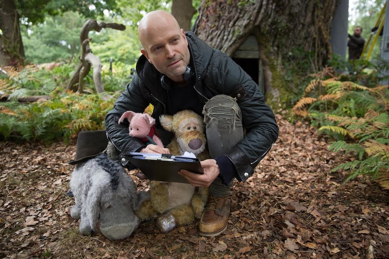 Marc Forster with Eeyore, Piglet and Tigger on the set of Disney’s CHRISTOPHER ROBIN. Laurie Sparham / Disney