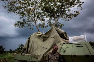 TOPSHOT - A soldier from the Armed Forces of the Democratic republic of the Congo(FARDC) is seen at their military base on October 06, 2018 outside Oicha.  Attacks on FARDC bases by the ADF has become more common. The ADF usually attack at night over the weekends, in search of arms, ammunition and medical supplies. / AFP / JOHN WESSELS
