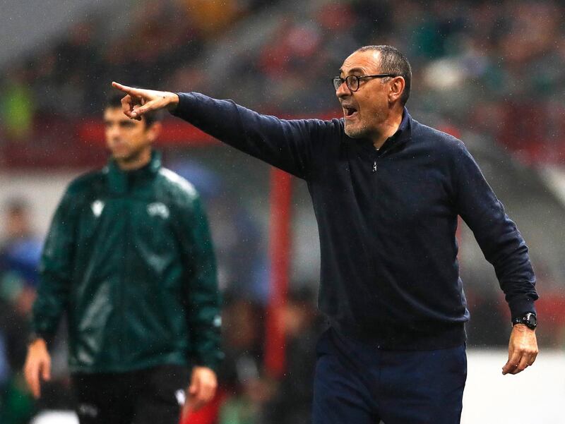 Juventus coach Maurizio Sarri watches from the sidelines.  EPA