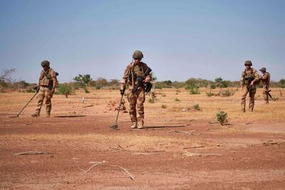(FILES) In this file photo taken on November 12, 2019 Soldiers from the French Army holds  detectors while searching for the presence of IED (Improvised Explosive Devices) during the Burkhane Operation in northern Burkina Faso. French President Emmanuel Macron will travel on June 30, 2020 to Nouakchott in Mauritania to participate in a G5 Sahel summit to review the anti-Jihadist struggle in this region where more than 5,000 French soldiers are deployed.
This meeting in the Mauritanian capital will be held 6 months after the summit in Pau (Southwest of France) where it was decided to intensify the anti-Jihadist struggle in a context of generalized deterioration of the security situation of particularly poor Sahelian countries.
 / AFP / MICHELE CATTANI
