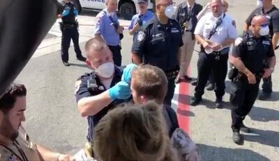 Passengers are assisted by the air cabin crew and the emergency services on a flight from New York to Dubai, at JFK Airport, New York, U.S., September 05, 2018 in this still image obtained from a social media video.   ERIN SYKES/via REUTERS THIS IMAGE HAS BEEN SUPPLIED BY A THIRD PARTY. MANDATORY CREDIT. NO RESALES. NO ARCHIVES.