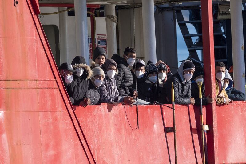 Migrants arrive aboard the rescue vessel 'Sea-Eye 4' at Pozzallo, southern Sicily, on December 24. AFP