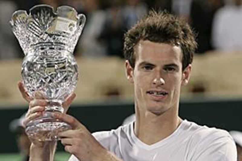 Andy Murray with his trophy after he defeated the world number one Rafael Nadal to win the Capitala World Tennis Championship in Abu Dhabi.