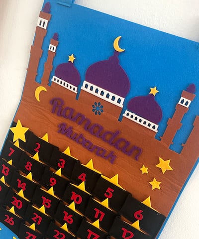 Mona has bought her five-year-old the Advent calendar-style countdown to Eid Al Fitr that will reveal a treat on each day of the holy month. Mona Farag / The National