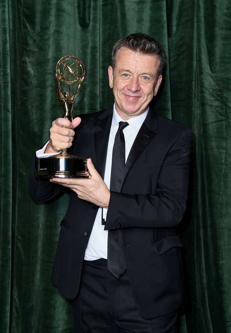 Peter Morgan celebrates winning the Emmy award for Outstanding Writing for a Drama Series for 'The Crown'. Getty Images