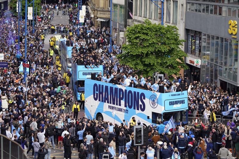 Manchester City players on the open-top bus during the Premier League trophy parade. PA