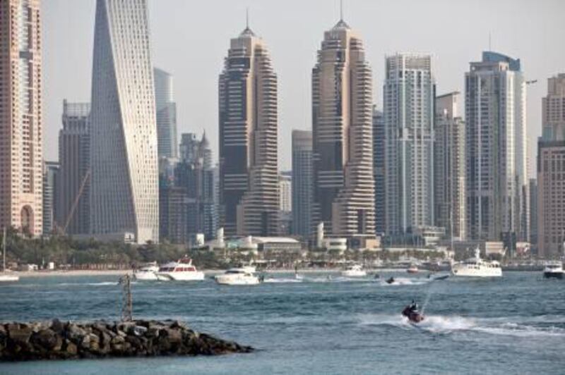 DUBAI, UNITED ARAB EMIRATES,  JUNE 06, 2013. General image of jet ski's. A rider sets off from around the start of the trunk of The Palm Jumeirah. Jet Skiers are allowed to enter this area but are not allowed to enter The Palm and jet ski between the houses. Permission for photography was not obtained from the pictured people. (ANTONIE ROBERTSON / The National)