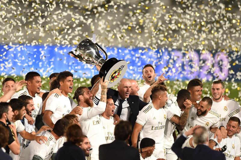 Real Madrid players lift the La Liga trophy after their win over Villarreal. Getty