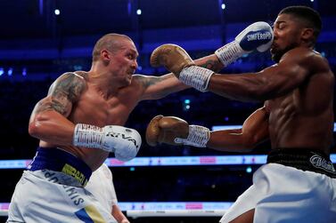 FILE PHOTO: Boxing - WBA, IBF & WBO Heavyweight Titles - Anthony Joshua v Oleksandr Usyk - Tottenham Hotspur Stadium, London, Britain - September 25, 2021 Oleksandr Usyk  in action against Anthony Joshua Action Images via Reuters / Andrew Couldridge / File Photo