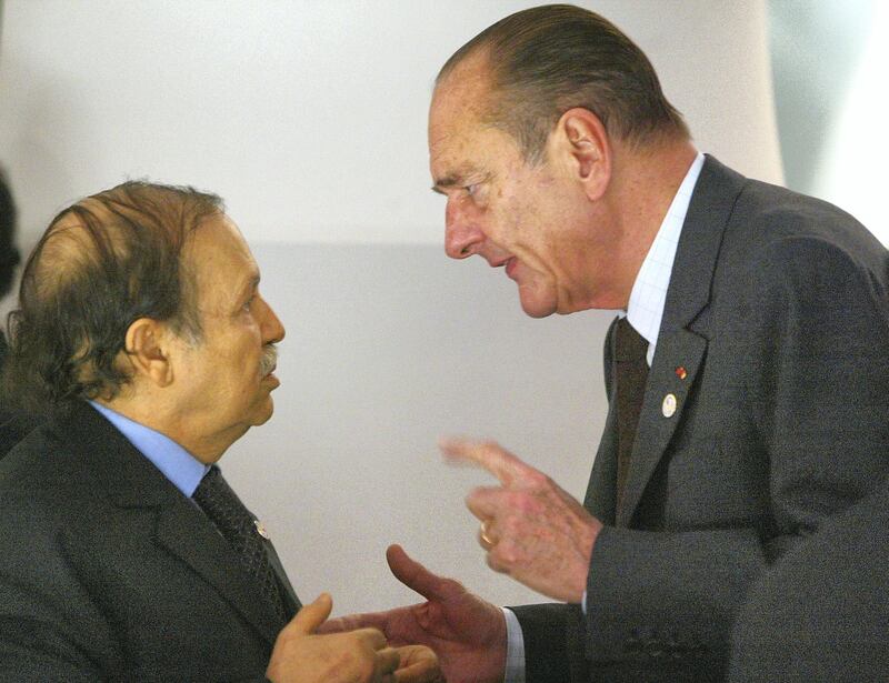 PARIS - FEBRUARY 21:  French President Jacques Chirac (R) speaks to Algerian President Abdelaziz Bouteflika in the 22nd African Heads of State Conference on February 21, 2003 in Paris, France. The Summit will focus on development and investment, Aids/HIV trade and conflict resolution with particular reference to the Ivory Coast.  (Photo by Pascal Le Segretain/Getty Images) 