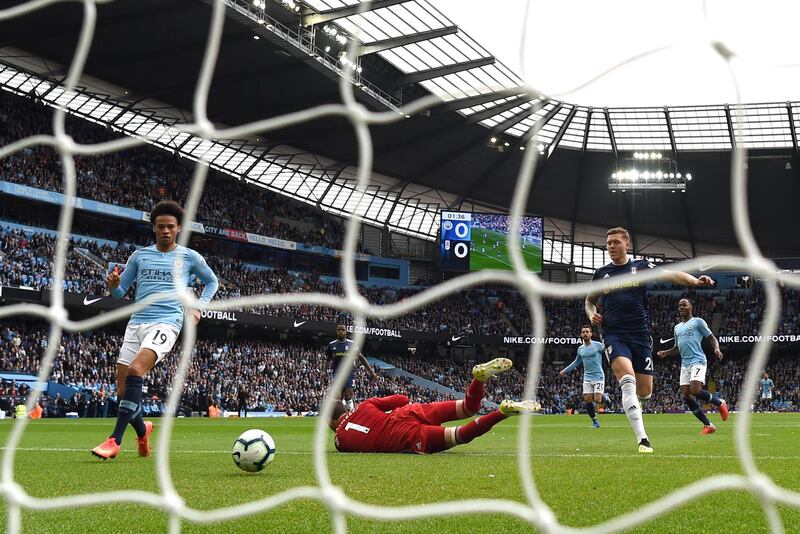 Leroy Sane scores his team's first goal past Marcus Bettinelli of Fulham - their 34th unbeaten match in a row against promoted teams at the Etihad Stadium. Getty Images