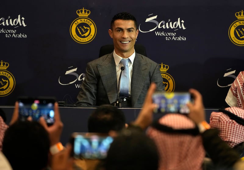 Cristiano Ronaldo smiles during his official unveiling. AP 