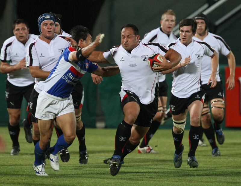 DUBAI, UNITED ARAB EMIRATES - MAY 14:   Action between Arabian Gulf's Michael Riley (C, in white) and Korea (in blue), during their Asian Five Nations international match at The Sevens rugby grounds in Dubai on May 14, 2010.  (Randi Sokoloff / The National)  For Sport story by Paul Radley
