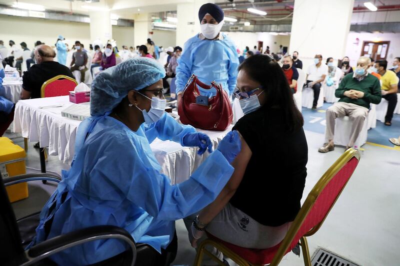 DUBAI, UNITED ARAB EMIRATES , Feb 6 – PEOPLE GETING THE FIRST DOSE OF SINOPHARM VACCINATION DURING THE VACCINATION DRIVE AT THE GURU NANAK DARBAR GURUDWARA IN DUBAI. Guru Nanak Darbar Gurudwara has partnered with Tamouh Health Care LLC, to provide on-site Sinopharm Vaccination for all residents of the UAE free of charge on 6th, 7th & 8th February 2021. (Pawan Singh / The National) For News/Online