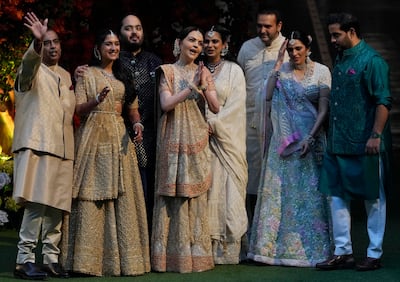 The Ambani family from left: Mukesh Ambani, Radhika Merchant, Anant Ambani, Nita Ambani, Isha Ambani, Anand Piramal, Shloka Mehta Ambani and Akash Ambani. AP