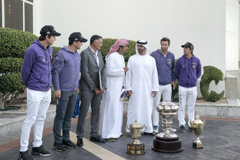 ABU DHABI, UNITED ARAB EMIRATES - February 05, 2018:  HH Sheikh Mohamed bin Zayed Al Nahyan Crown Prince of Abu Dhabi Deputy Supreme Commander of the UAE Armed Forces (3rd R), receives members of the Abu Dhabi Polo team, the winners of the HH The President of the UAE Cup Polo tournament, during a Sea Palace barza. 

( Mohamed Al Hammadi / Crown Prince Court - Abu Dhabi )
---