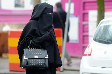 A woman wearing a niqab as she walks in a street in Roubaix, northern France. France was one of the first countries to ban face veils. AFP