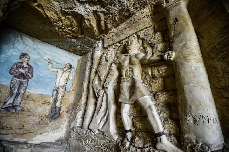 This picture taken shows a view of a relief sculpture made by Polish artist Mario at the St. Simon the Tanner Monastery complex in the Egyptian capital Cairo's eastern hillside Mokattam district, depicting the torture of the Old Testament Biblical figure Samson at the hands of the Philistines according to the Book of Judges. Mario spent more than two decades carving the rugged insides of the seven cave churches and chapels of the rock-hewn St. Simon Monastery and church complex atop Cairo's Mokattam hills, with designs inspired by biblical stories. It was all done to fulfil the wishes of the church's parish priest who met Mario in the early 1990s in Cairo. The Polish artist, who had arrived in Egypt earlier on an educational mission, was then looking for an opportunity to serve God at the monastery. AFP