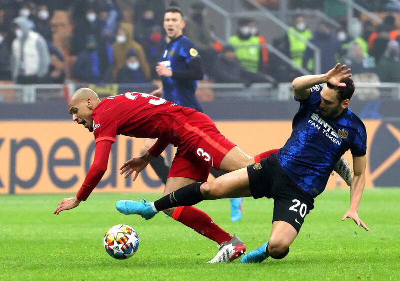 Liverpool's Fabinho and Inter's Hakan Calhanoglu tangle.  EPA