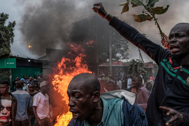 Supporters of Raila Odinga protest in Kibera against the result of the close vote. Deputy President William Ruto was declared the winner, despite several commissioners rejecting the results. AFP