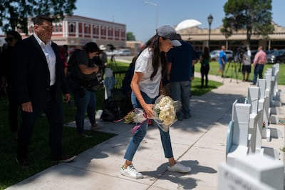 Meghan Markle, Duchess of Sussex, visits a memorial site with flowers to honour the victims killed in this week's school shooting in Uvalde, Texas. AP
