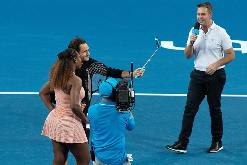 Roger Federer of Switzerland and Serena Williams of the USA take a selfie on court after playing in the mixed doubles match alongside Belinda Bencic of Switzerland and Frances Tiafoe of the USA on Day 4 of the Hopman Cup in Perth. EPA