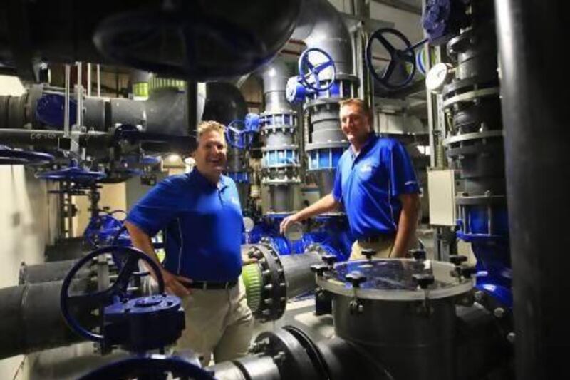 General manager Mike Oswald, left, and Tim Mow, assistant manager, keep an eye on a water-control area beneath the park.