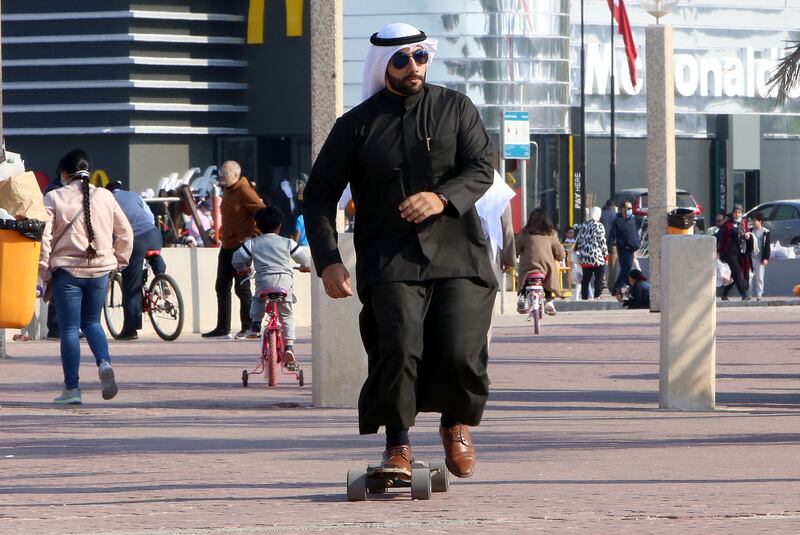 A Kuwaiti rides a skateboard, on a warm day near the beachfront, in the capital Kuwait City. More than 80 per cent of young Kuwaitis believe Covid-19 has affected their education. Photo: Yasser Al Zayyat / AFP