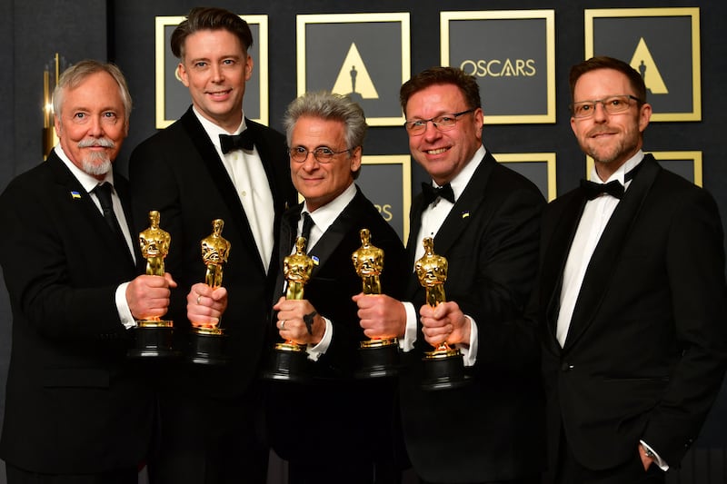 The sound team of 'Dune', from left, Doug Hemphill, Theo Green, Mark Mangini, Ron Barlett, and Mac Ruth in the press room during the 94th Oscars at the Dolby Theatre in Hollywood, California. AFP