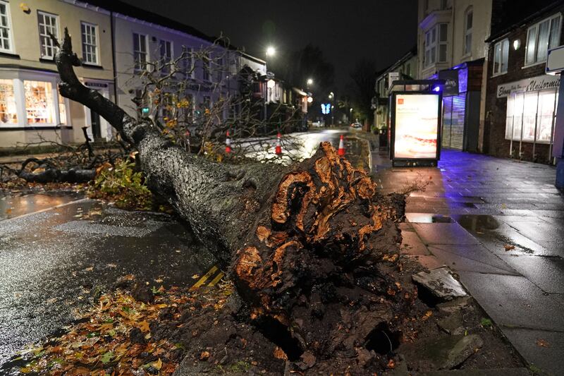A fallen tree blocks a road in the centre of Norton village, County Durham after Storm Arwen's gusts of almost 160kph battered some areas of the UK. Photo: PA