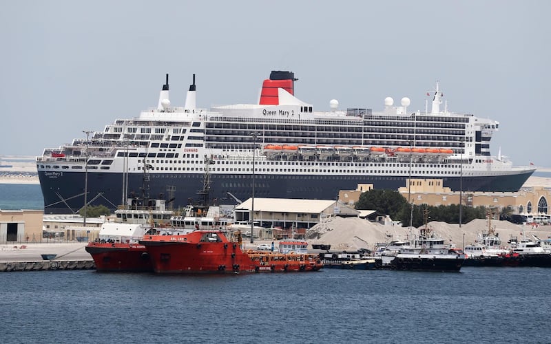 The Queen Mary II luxury cruise liner, also known as the QE2, is seen docked at Port Rashid in Dubai, where it will be moored permanently as a newly refurbished floating hotel on April 18, 2018. (Photo by KARIM SAHIB / AFP)